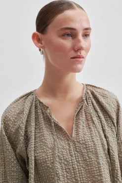 Dames blouse lange mouw bruin