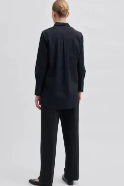 Dames blouse lange mouw zwart